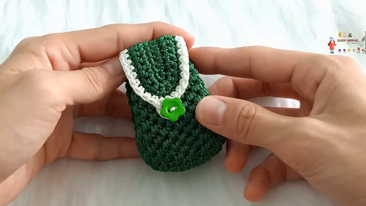 green backpack bag charm
