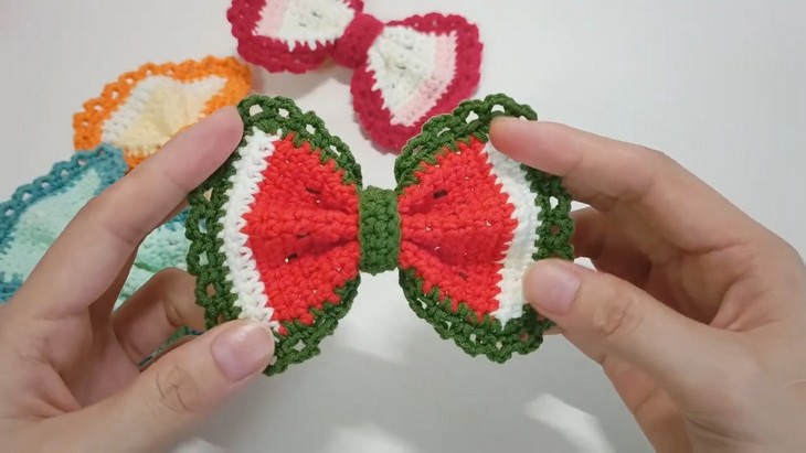 crochet watermelon bow in hand